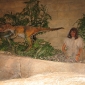 demon child plays with dinosaur at dawn of time 6000 years ago