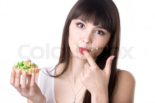 17744418-woman-licking-her-fingers-while-eating-cake