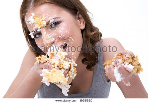 young-cute-woman-eating-cake-over-white-background-egtbe0